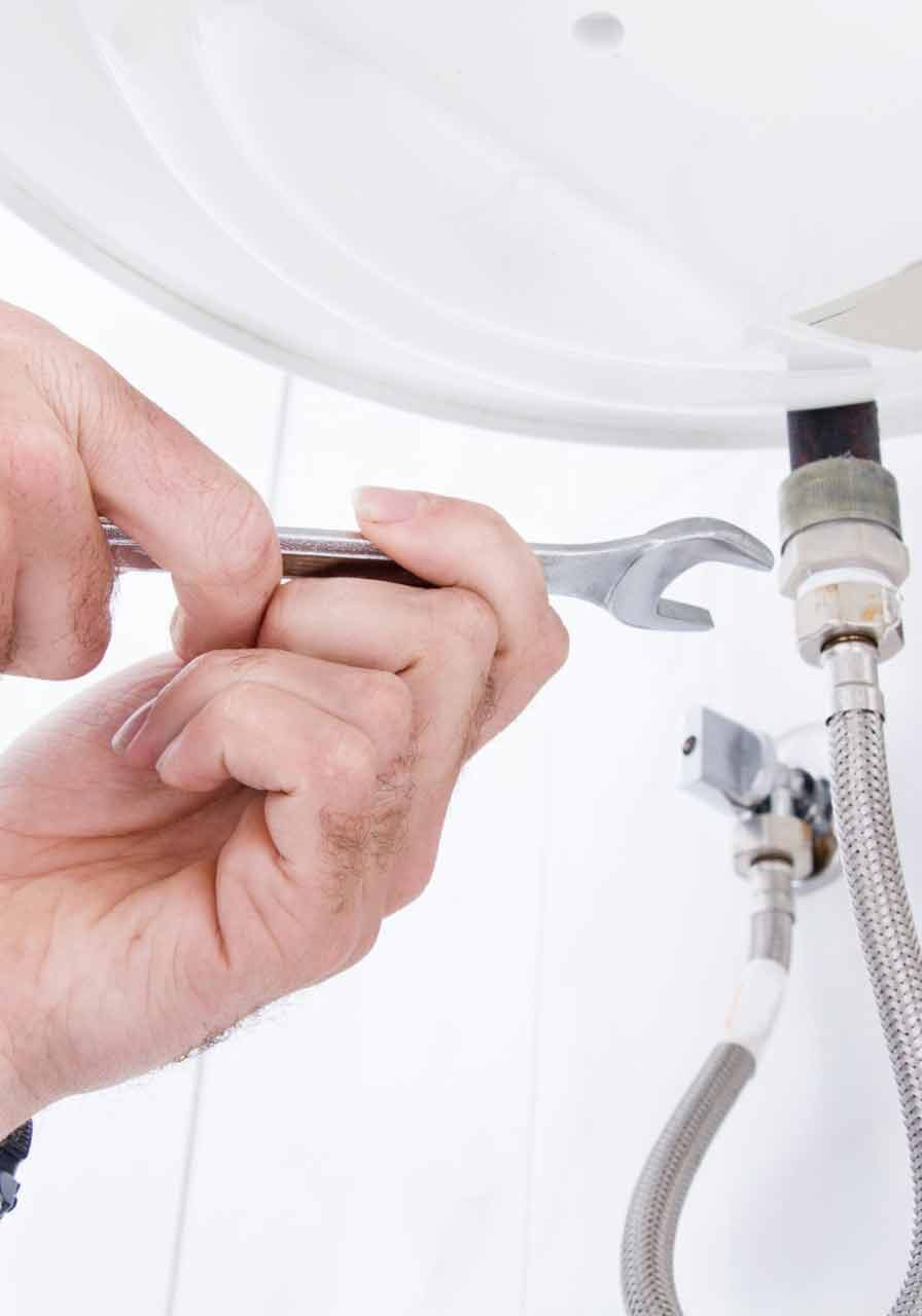 plumber-fixing-electric-water-heater-scaled